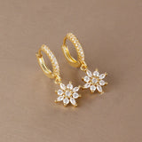 Stainless steel star dangle earrings with sparkling zircon accents by HSF Marketplace