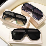 Vintage square sunglasses for women and men by HSF Marketplace, rectangle style eyewear with black frames and tinted lenses.