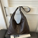 Large black leather tote bag for women with shoulder strap, spacious interior, and simple elegant design from HSF Marketplace.