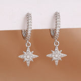 Stainless steel star dangle earrings with sparkling zircons by HSF Marketplace