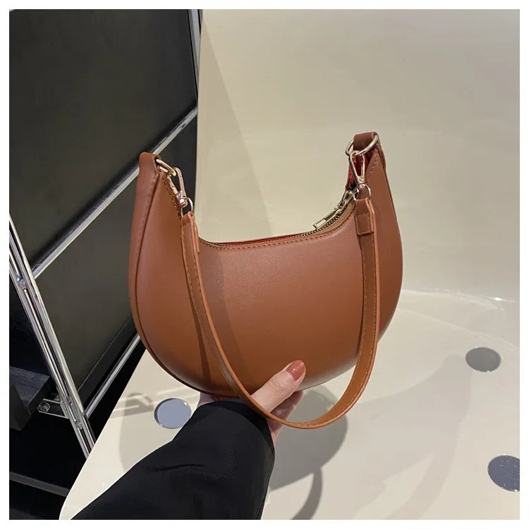 Luxury moon-shaped women's handbag by HSF Marketplace, elegant single shoulder purse with high-end fashion design.