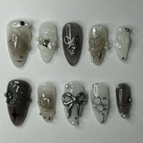 Pink almond false nails with bowknots, love hearts, and pearl designs, 24-piece detachable Korean press-on nail set