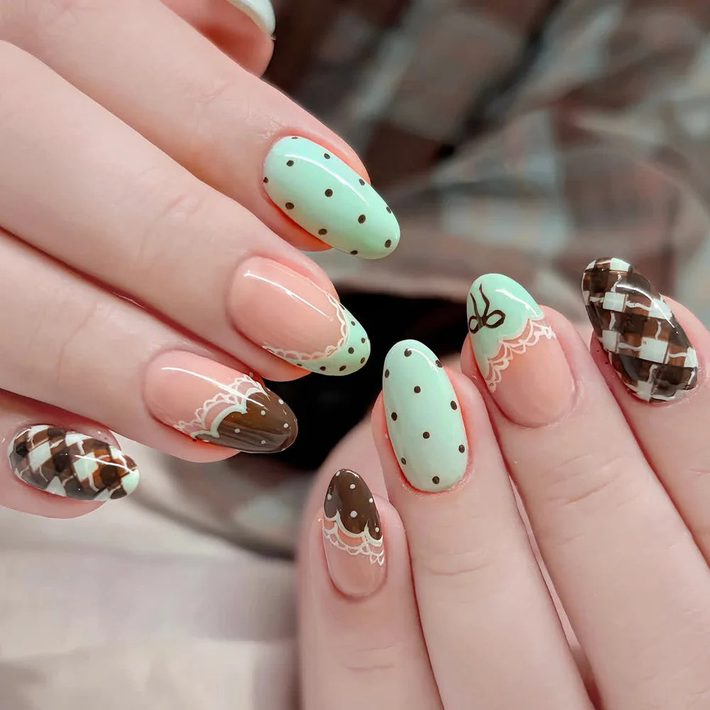 Pink almond press-on false nails with bowknots, love hearts, and pearl designs by HSF Marketplace