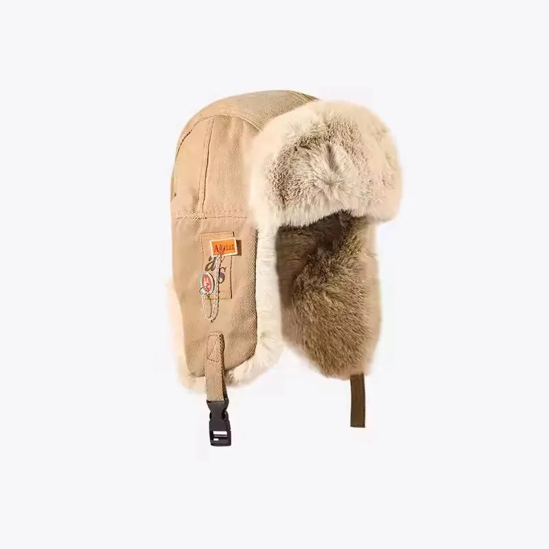 Black and grey women's Russian ushanka bomber hat with thick warm fur, earflaps, and winter ski cap design