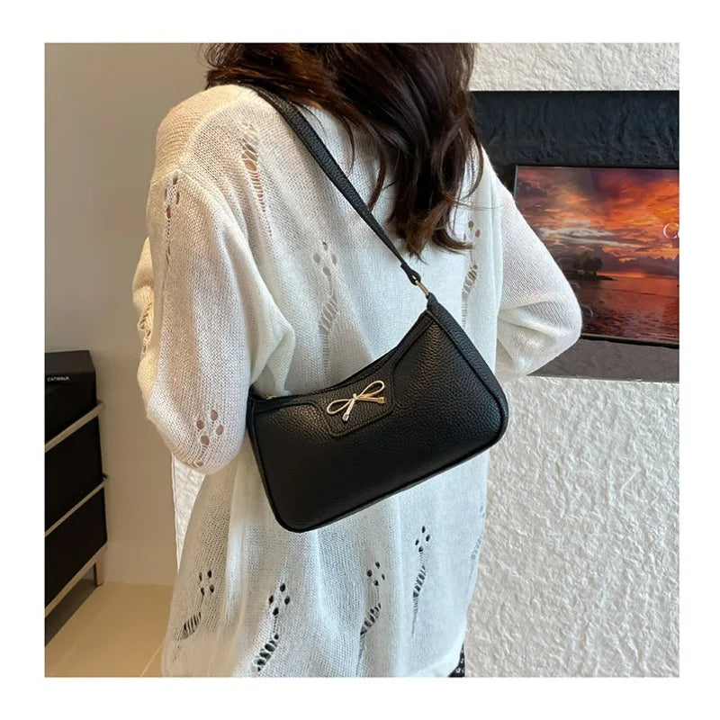 Ladies bow design underarm shoulder bag by HSF Marketplace, stylish and functional handbag for daily commute and fashion.