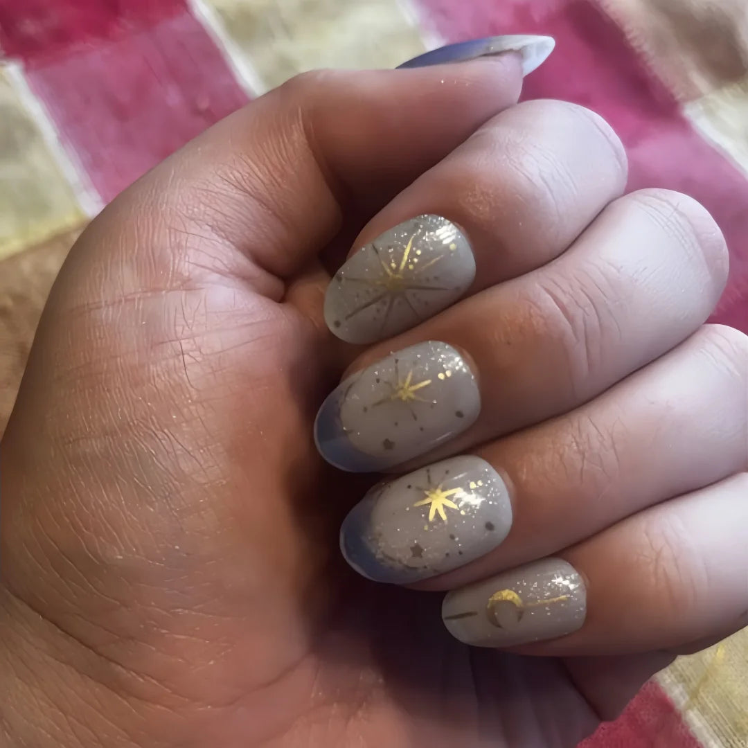 24-piece Y2K gradient blue French press-on false nails with gold star and moon designs, almond shape