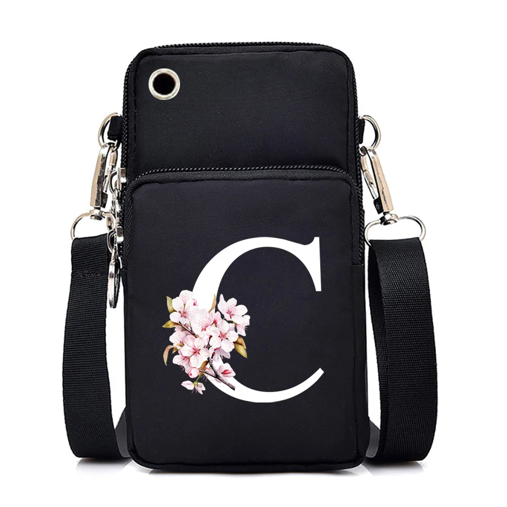 Fashion floral letter crossbody bag for women with Sakura alphabet graphics, mobile phone compartment, and stylish purse design.