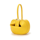 Elegant small genuine leather handbag with a round top handle, perfect for women’s evening parties and going out.