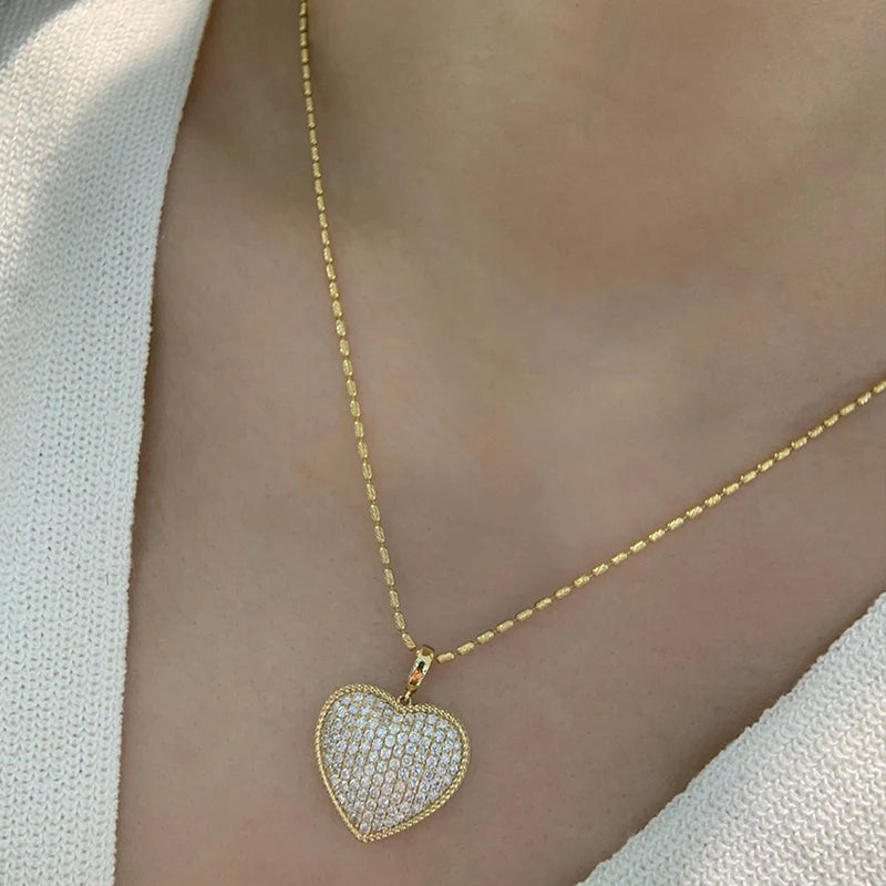 Huitan sparkling heart pendant necklace with cubic zirconia, elegant jewelry for women, perfect for weddings and special occasions.