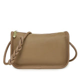 Genuine cowhide leather crossbody handbag for women, high-capacity shoulder bag with stylish design and spacious interior.