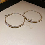 Shiny geometric cross hoop earrings with rhinestones for women, high-end statement jewelry by HSF Marketplace