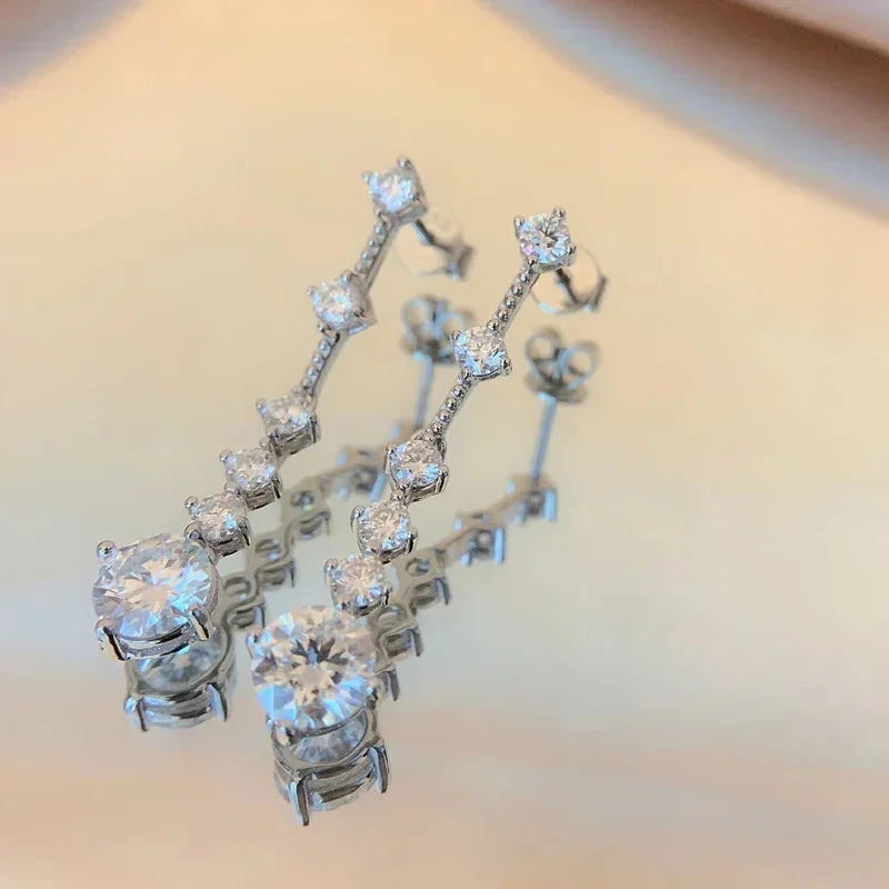 Moissanite dangle earrings with 3ct VVS1 stones, silver tassel design by HSF Marketplace
