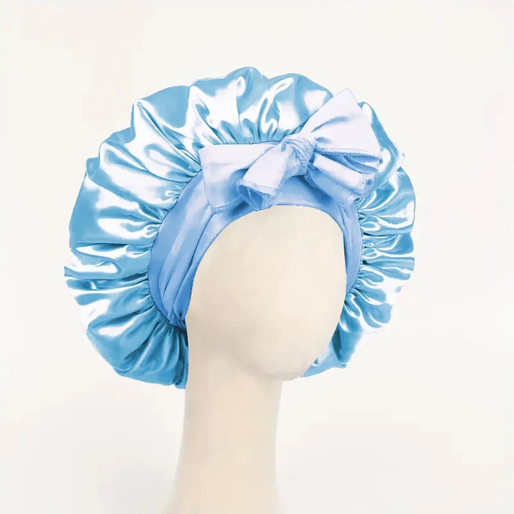 Silk satin bonnet with adjustable tie band, suitable for sleeping, worn by women and men to protect hair and style.