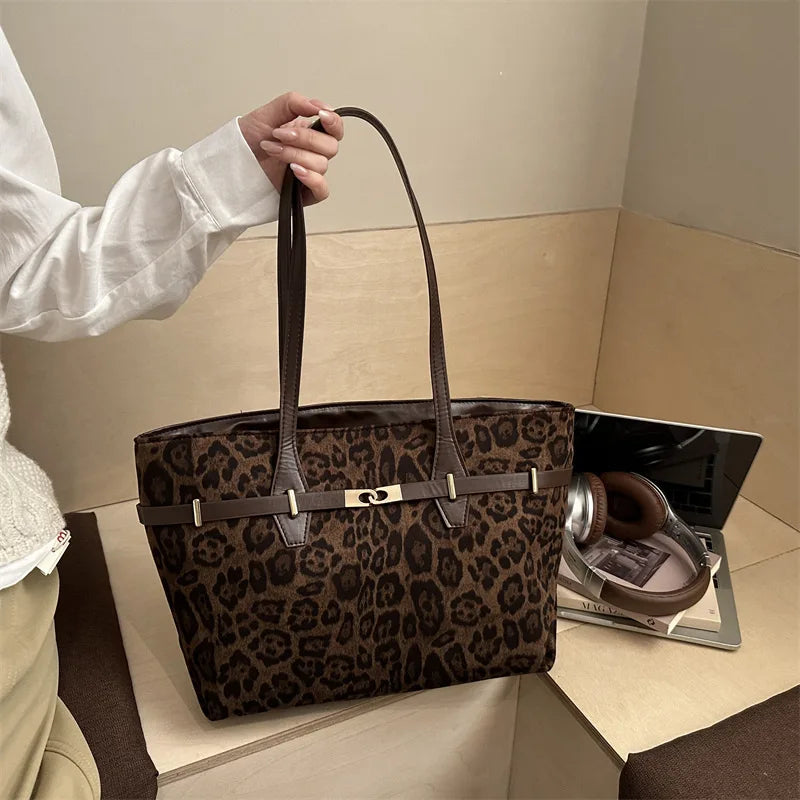 Leopard print shoulder tote bag with faux leather trim, gold lock detail, spacious design, ideal for women’s work and daily use.