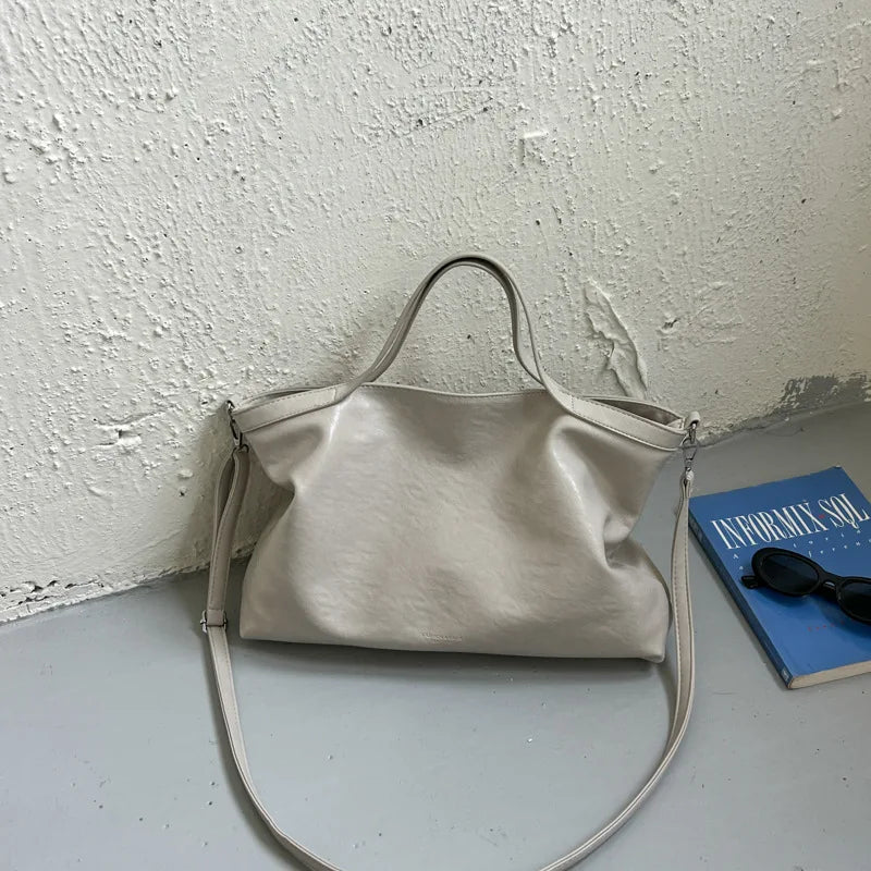 Luxury PU leather women's handbag with spacious design, shoulder and crossbody styles, perfect for commuting and office use.