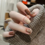 24-piece cute girly short square false nails with white French tips, glitter stars, rhinestones, cat eye, and bows