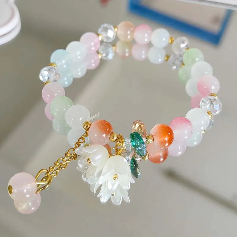 Colorful Lily Valley flower bracelet for women with crystal beads, elastic design, perfect for wedding or birthday jewelry.