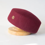 Women's vintage wool felt beret hat with hard concave top, pillbox fascinator style for weddings and cocktail parties