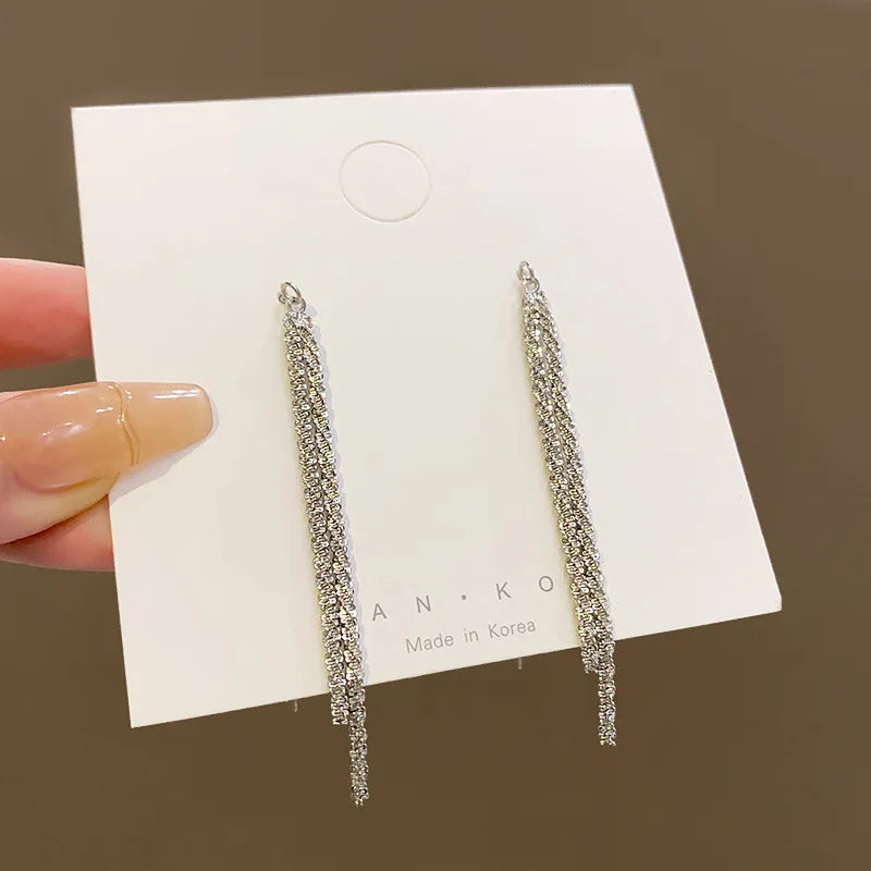 Long tassel dangle earrings for women in trendy Korean style, featuring flowing tassel details.