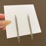 Long tassel dangle earrings for women in trendy Korean style, featuring flowing tassel details.