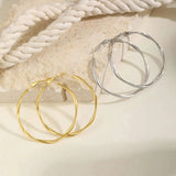 Stainless steel twist circle hoop earrings for women by HSF Marketplace