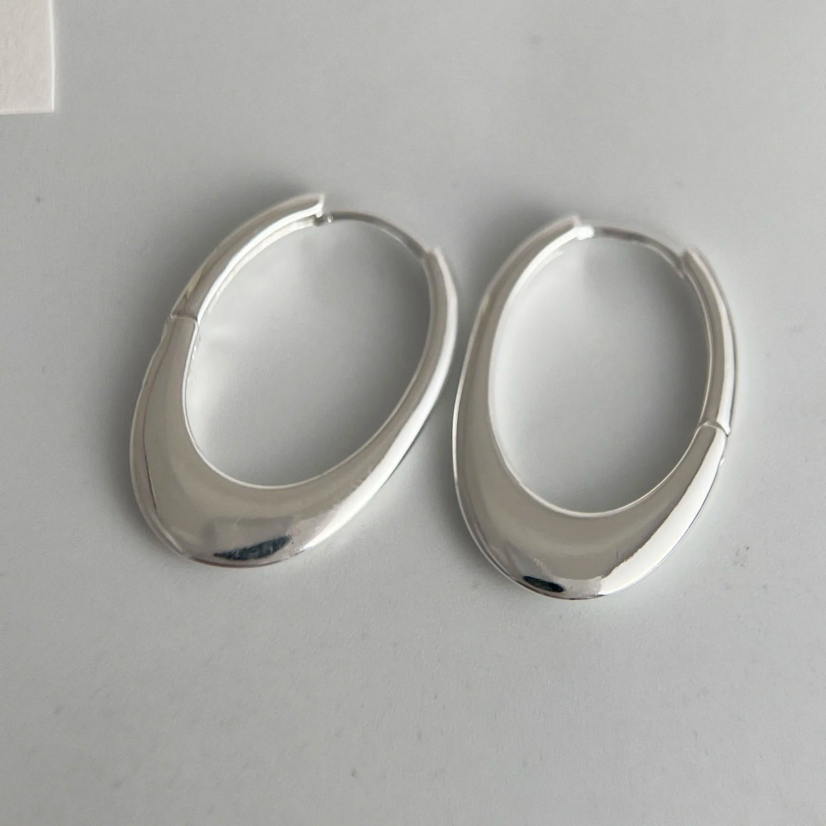 925 sterling silver oval hollow hoop earrings for women, trendy jewelry accessory in a shiny finish