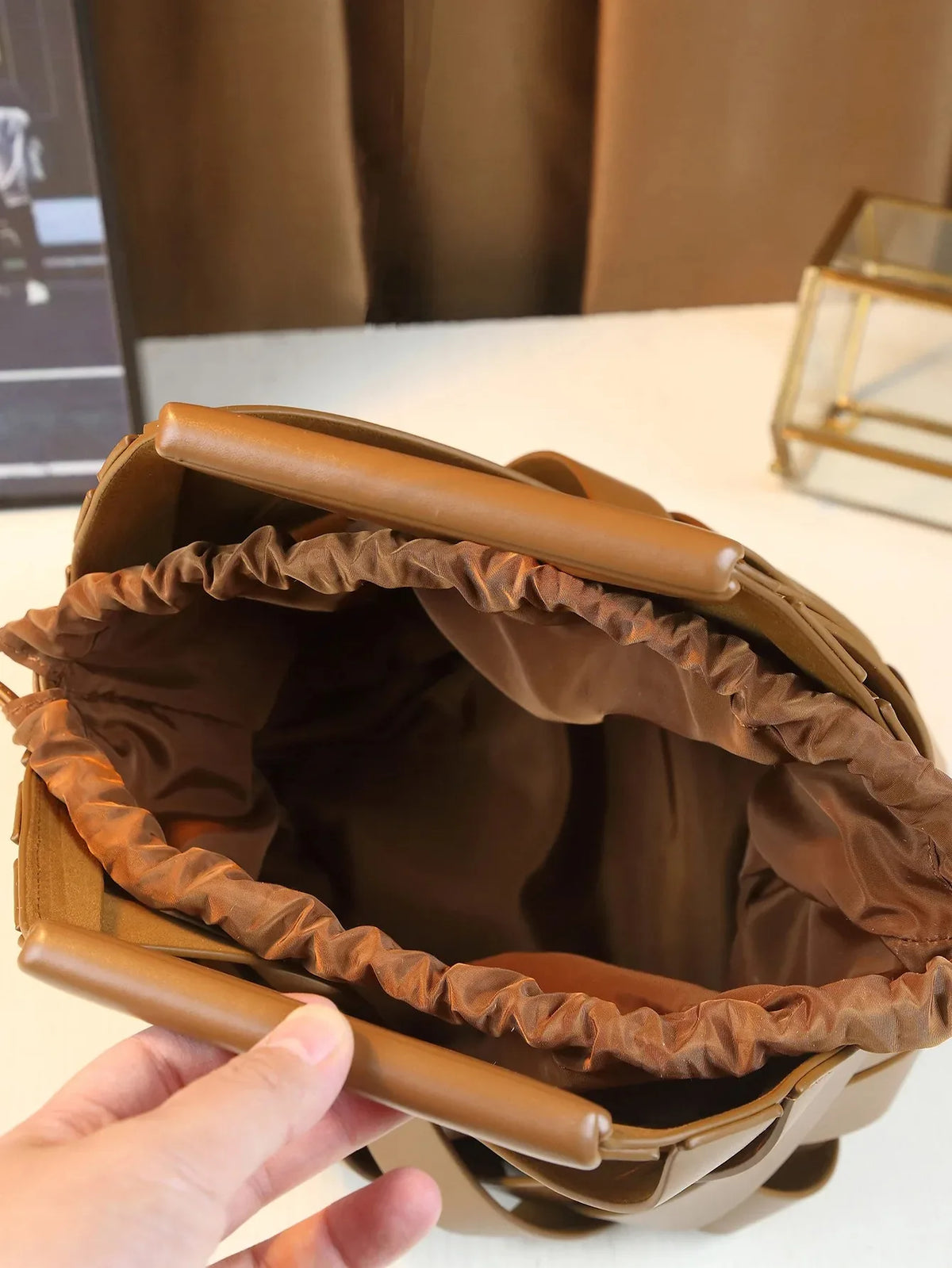 Trendy vegan leather woven tote bag for women, featuring top handles and crossbody strap, fashionable handbag by HSF Marketplace.