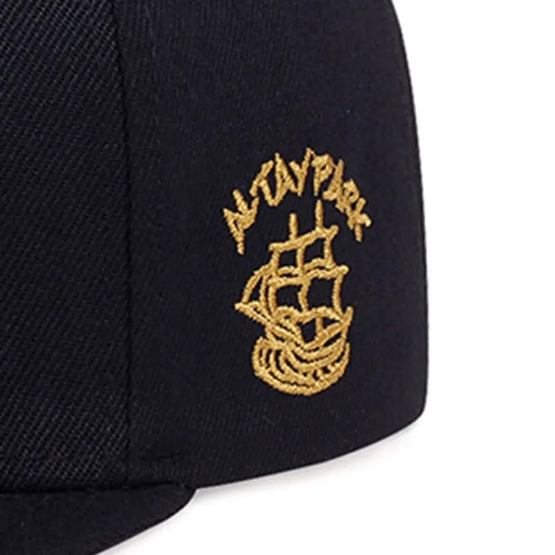 Women's hip hop baseball cap with embroidered crown, trucker mesh panels, and snapback closure for outdoor wear