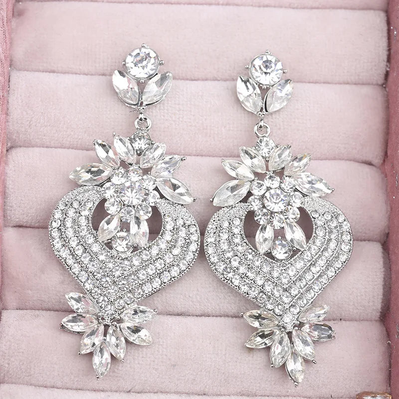 Chic champagne crystal chandelier earrings for women by HSF Marketplace, featuring cascading sparkling stones