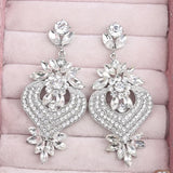 Chic champagne crystal chandelier earrings for women by HSF Marketplace, featuring cascading sparkling stones