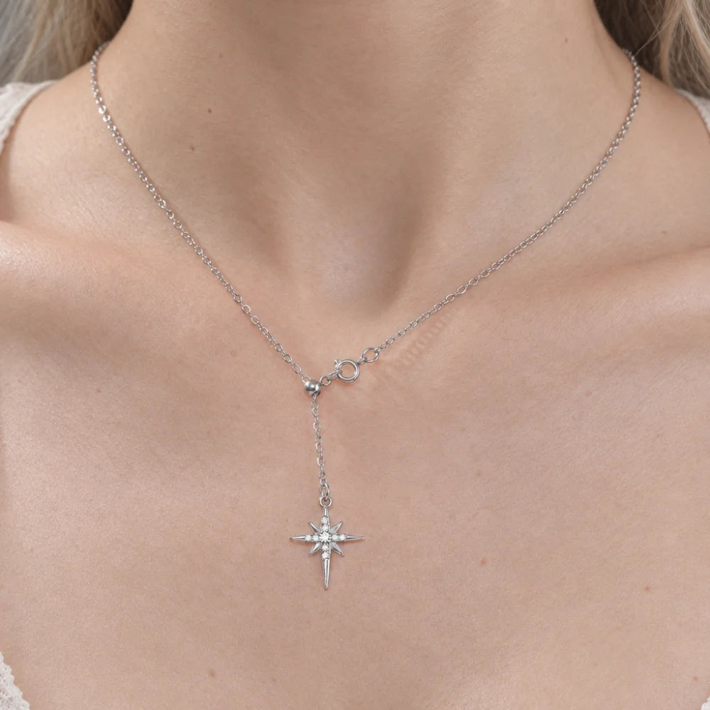 Gold stainless steel North Star pendant necklace with zircon accents, featuring an eight-pointed star design on a delicate chain.