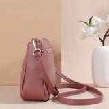Fashion PU leather crossbody bag for women with zipper, embroidery details, large capacity, and a small purse for everyday use.