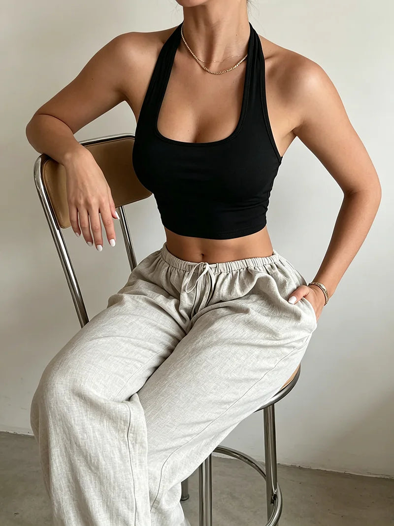 Women's sleeveless backless vest top by HSF Marketplace, casual elegant solid color hanging neck design for summer comfort.