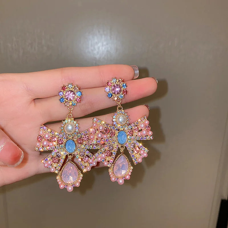 Pink crystal bowknot drop earrings for women, trendy statement jewelry by HSF Marketplace