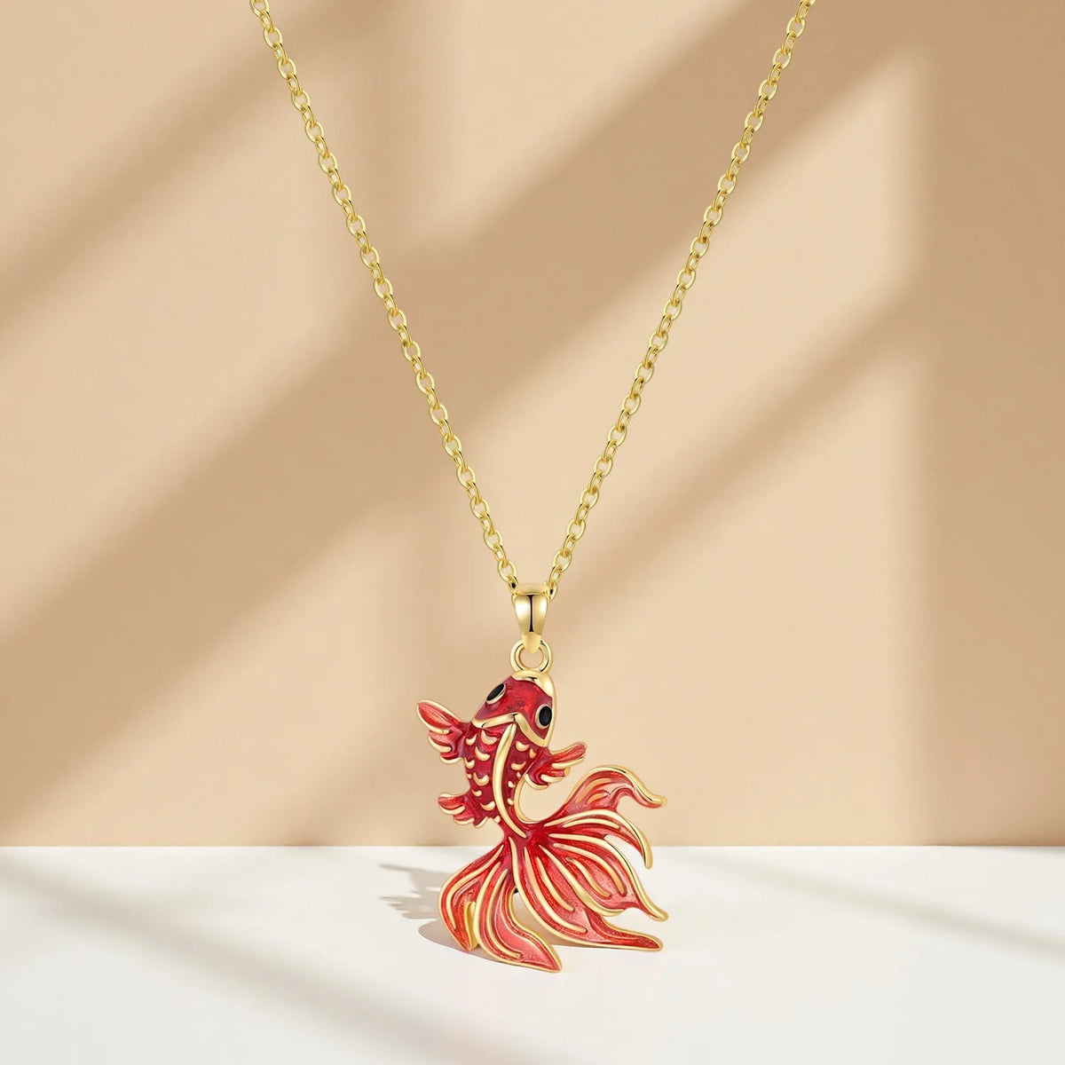 Sterling silver gold-finished fighting fish pendant necklace for women, featuring detailed fish design, fine jewelry gift.