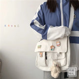 Casual women's canvas messenger bag with printed design, shoulder strap, and pouch for everyday use, by HSF Marketplace.