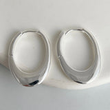 925 sterling silver trendy oval hoop earrings for women, big hollow design jewelry shown close-up