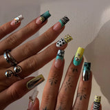 HSF Marketplace pink and black Sweet Punk press-on false nails with polka dots, stripes, and long coffin tips