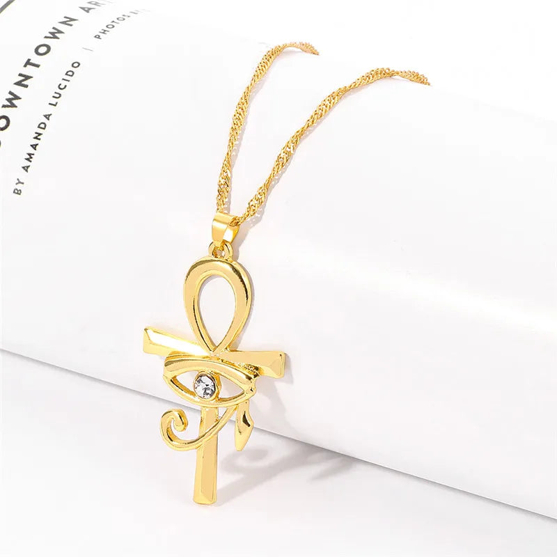 Eye of Horus Egypt charm pendant featuring an Ankh cross on a stylish necklace, ideal for women’s religious jewelry.
