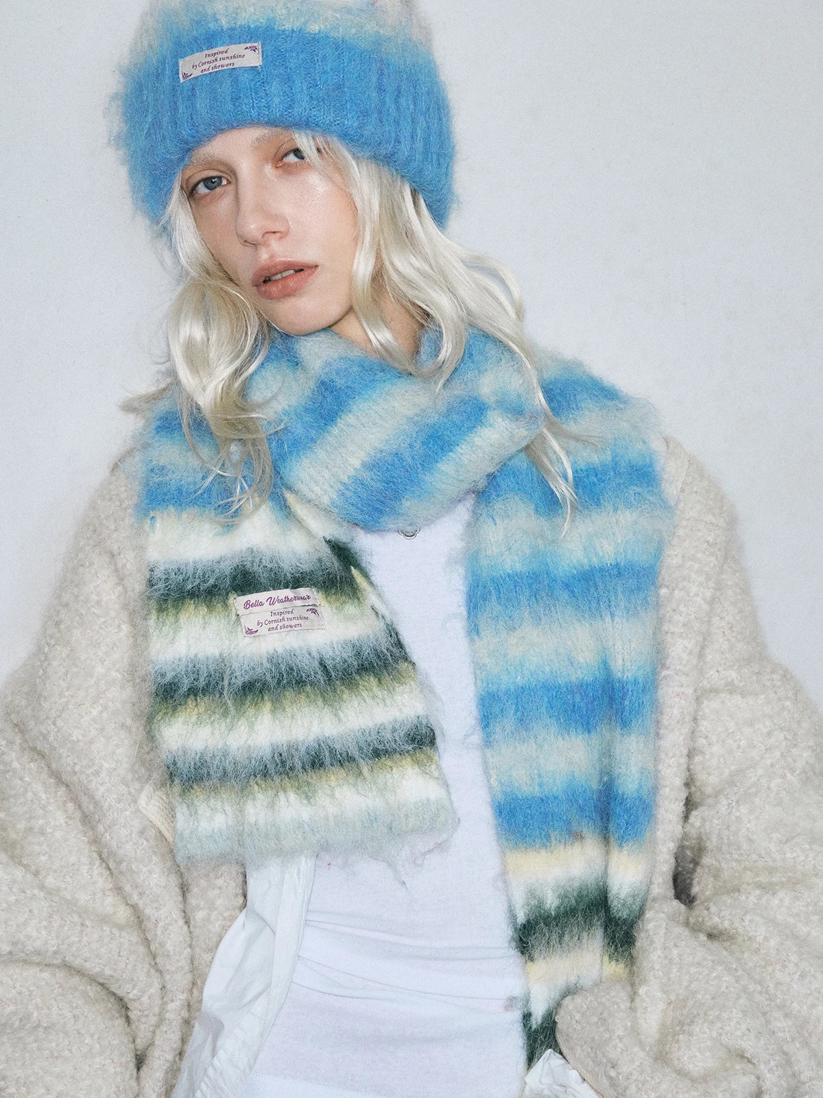 Warm striped scarf and gloves set for cold weather, featuring cozy winter accessories from HSF Marketplace