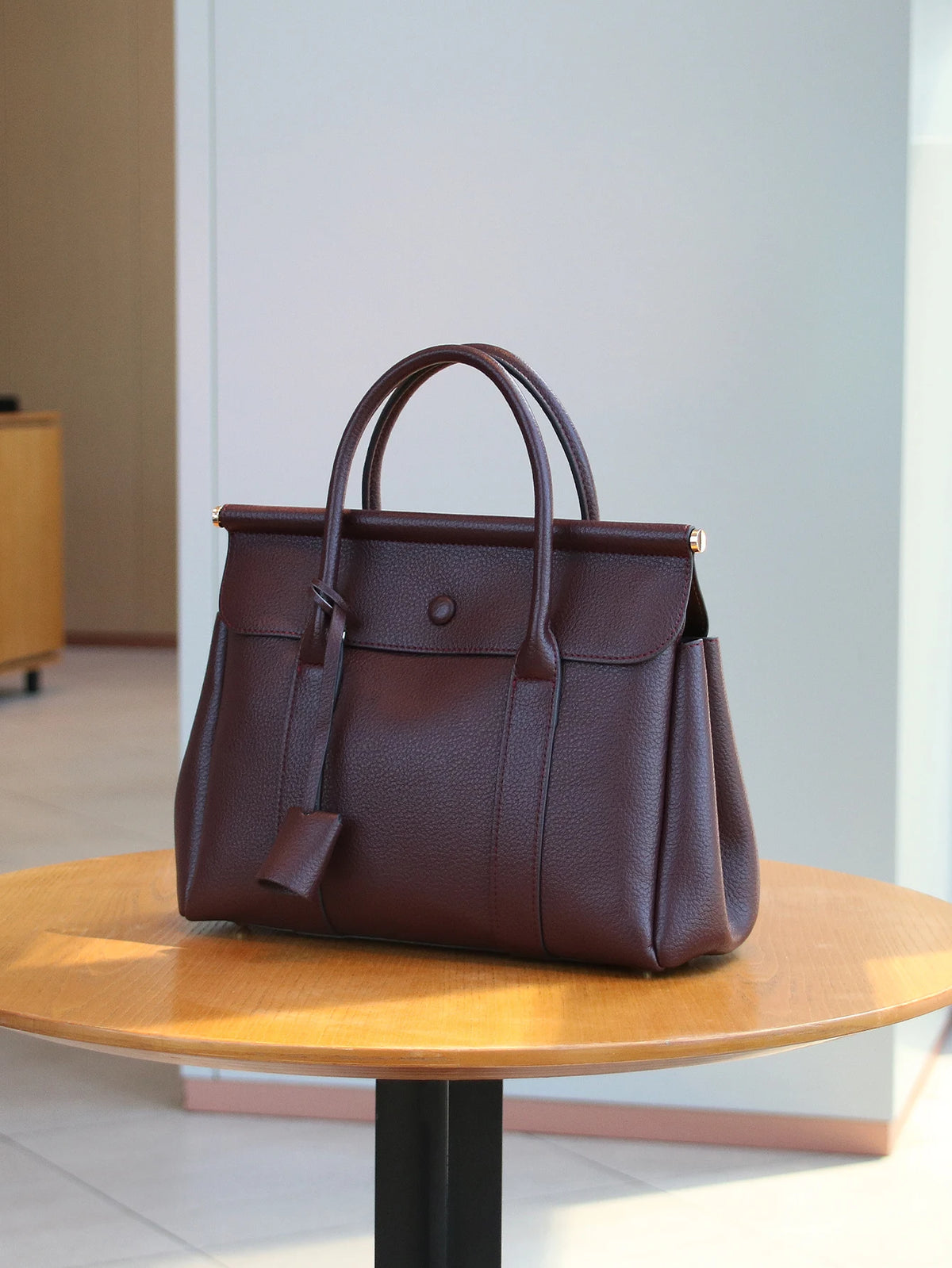Vintage leather women's handbag with flap closure, soft shoulder strap, suitable for office and commute, by HSF Marketplace.