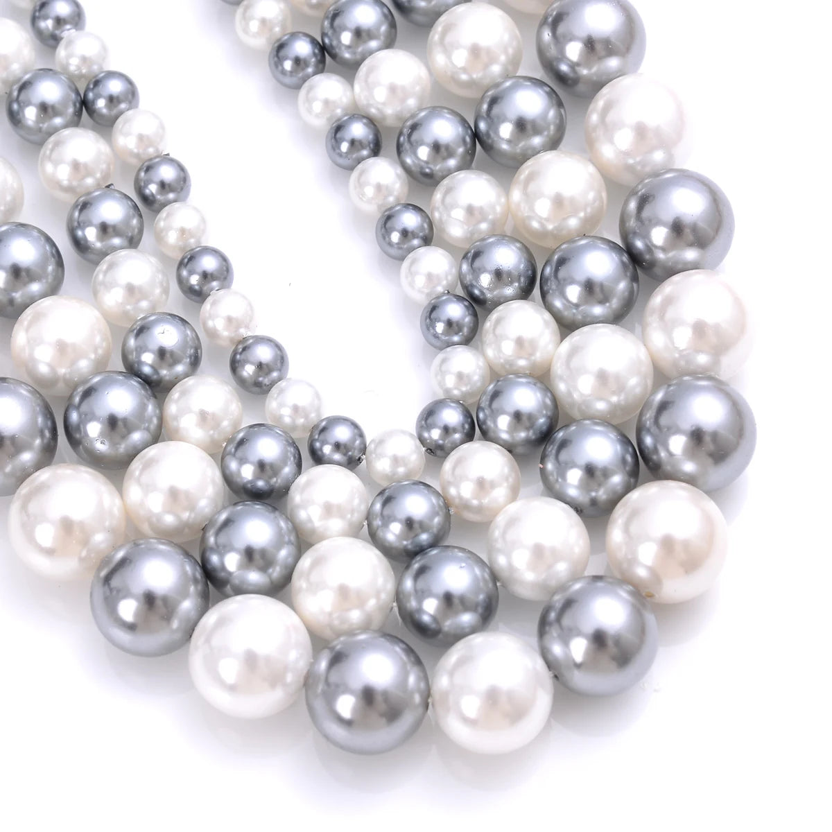 Natural freshwater shell pearls for jewelry making beads, displayed as loose round beads.