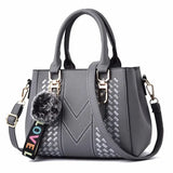 Leather embroidery messenger bag for women, featuring a hairball design, stylish handbag perfect for daily use.