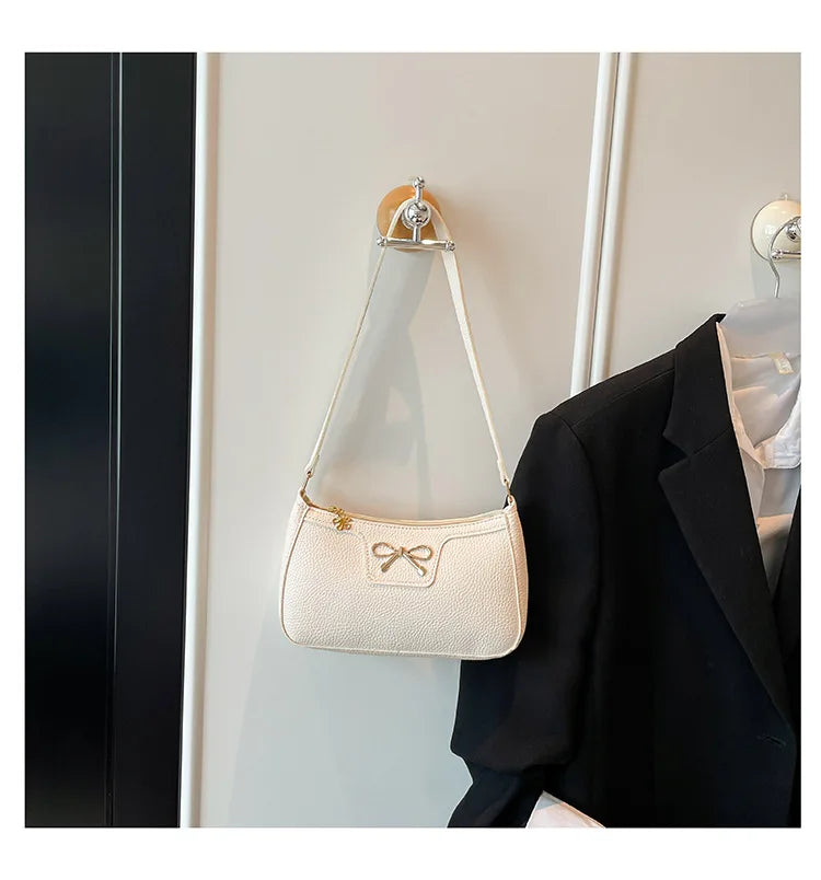 Ladies bow design underarm shoulder handbag featuring a fashionable and personality-driven style, ideal for commuting.