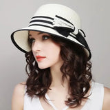 Women's Muchique boater straw hat with wide brim, casual bow, and sun protection for beach travel