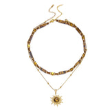 Gold PVD plated tiger eye stone stainless steel sun necklace for women, waterproof, tarnish-free choker chain jewelry.