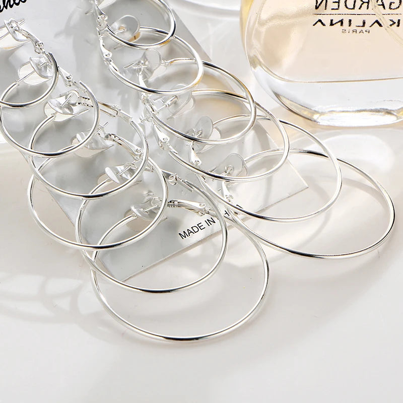 Set of 12 pairs of simple punk hoop earrings, large round jewelry for women and girls, oversized ear hoops in a variety of styles.