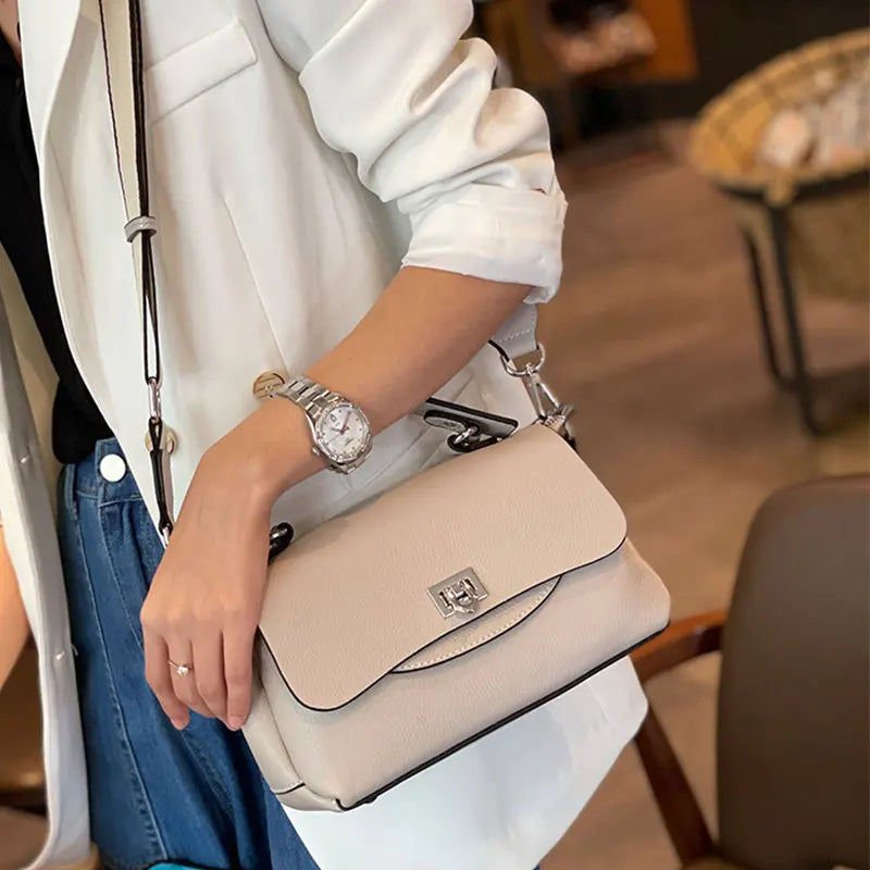 Luxury genuine leather women's crossbody bag in a structured design with adjustable strap