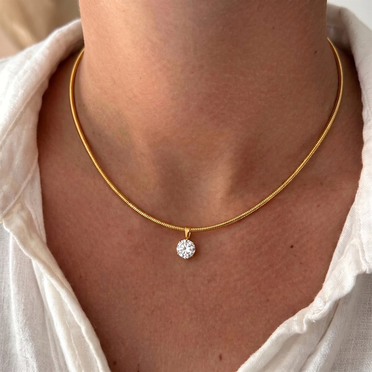Gold-plated stainless steel choker necklace with cubic zirconia accents, waterproof jewelry for women, ideal for daily wear and parties.