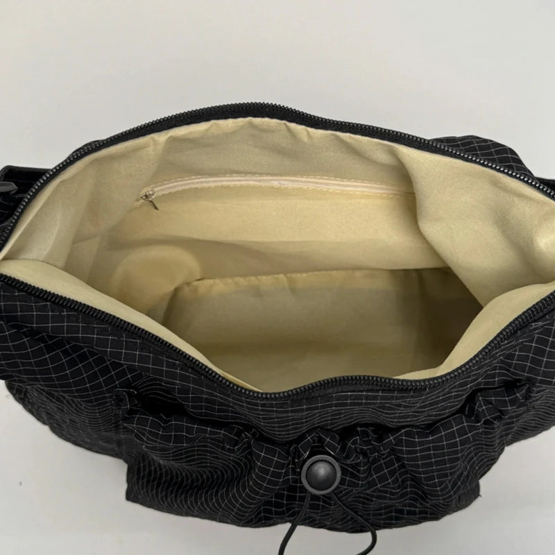 Women checkered nylon sling bag with drawstring closure, large capacity trendy crossbody purse for shopping and casual outings.